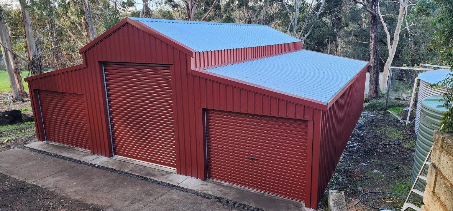 Red triple-bay shed with roller doors